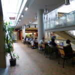 Why do more women than men engage in the community?